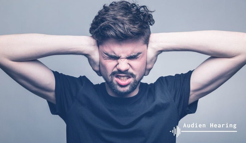 Individual experiencing tinnitus pain